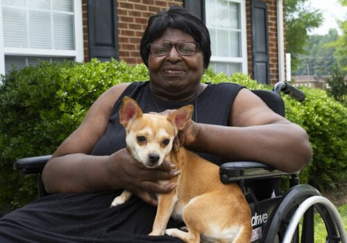 Woman holding dog