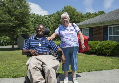 Woman delivering meal to recipient