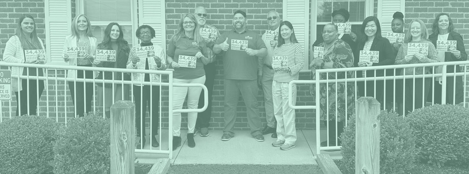 group in front of building holding pamphlets