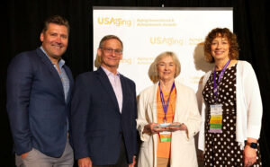 Four People at Awards Ceremony