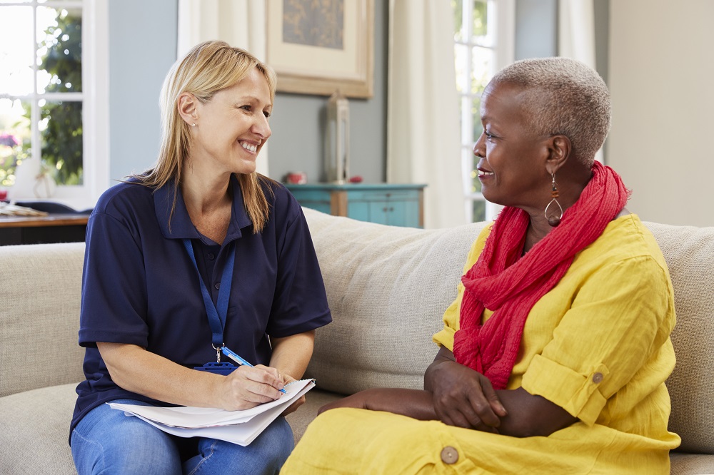 Female Care Navigator visits woman at home